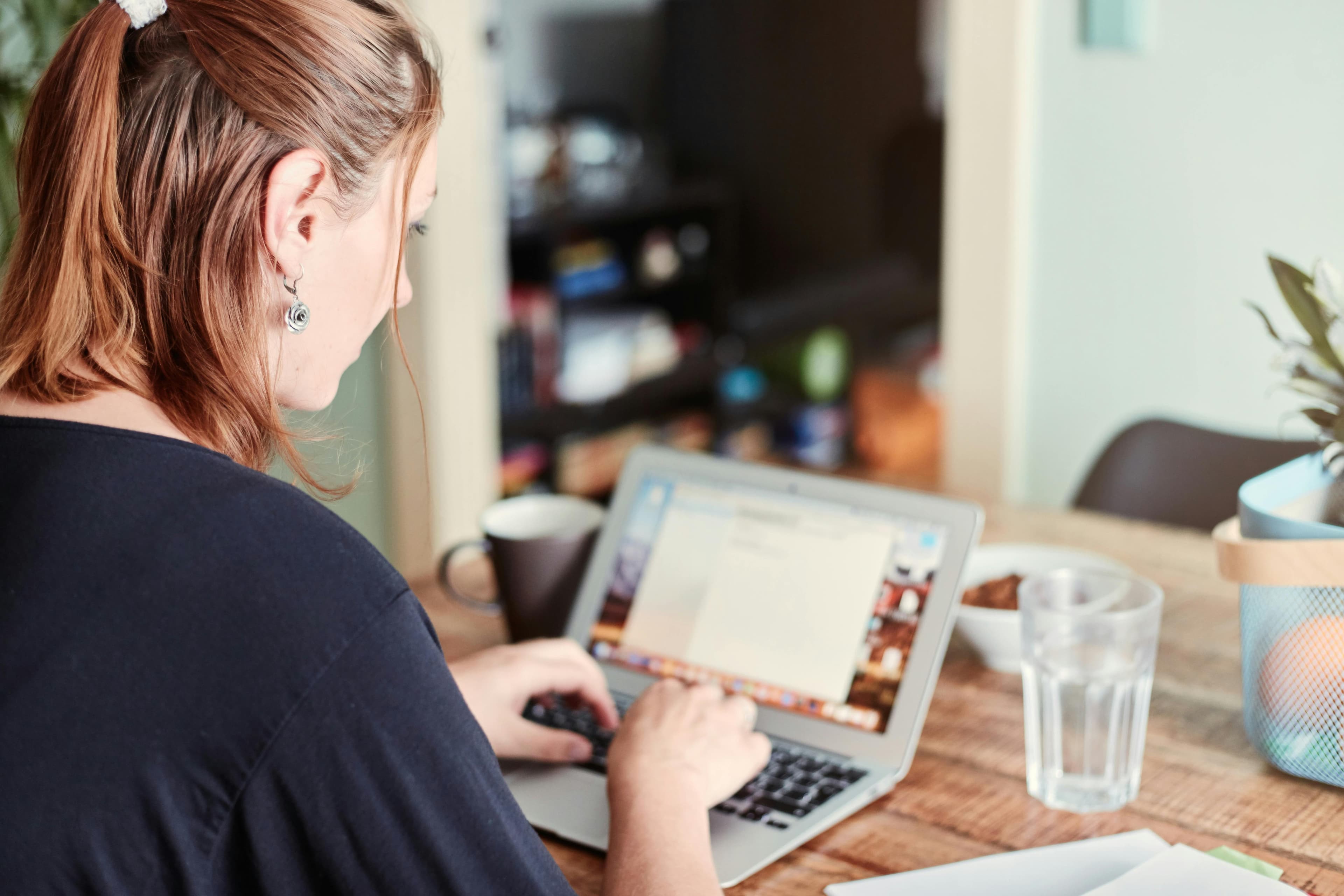 A team member working on a laptop