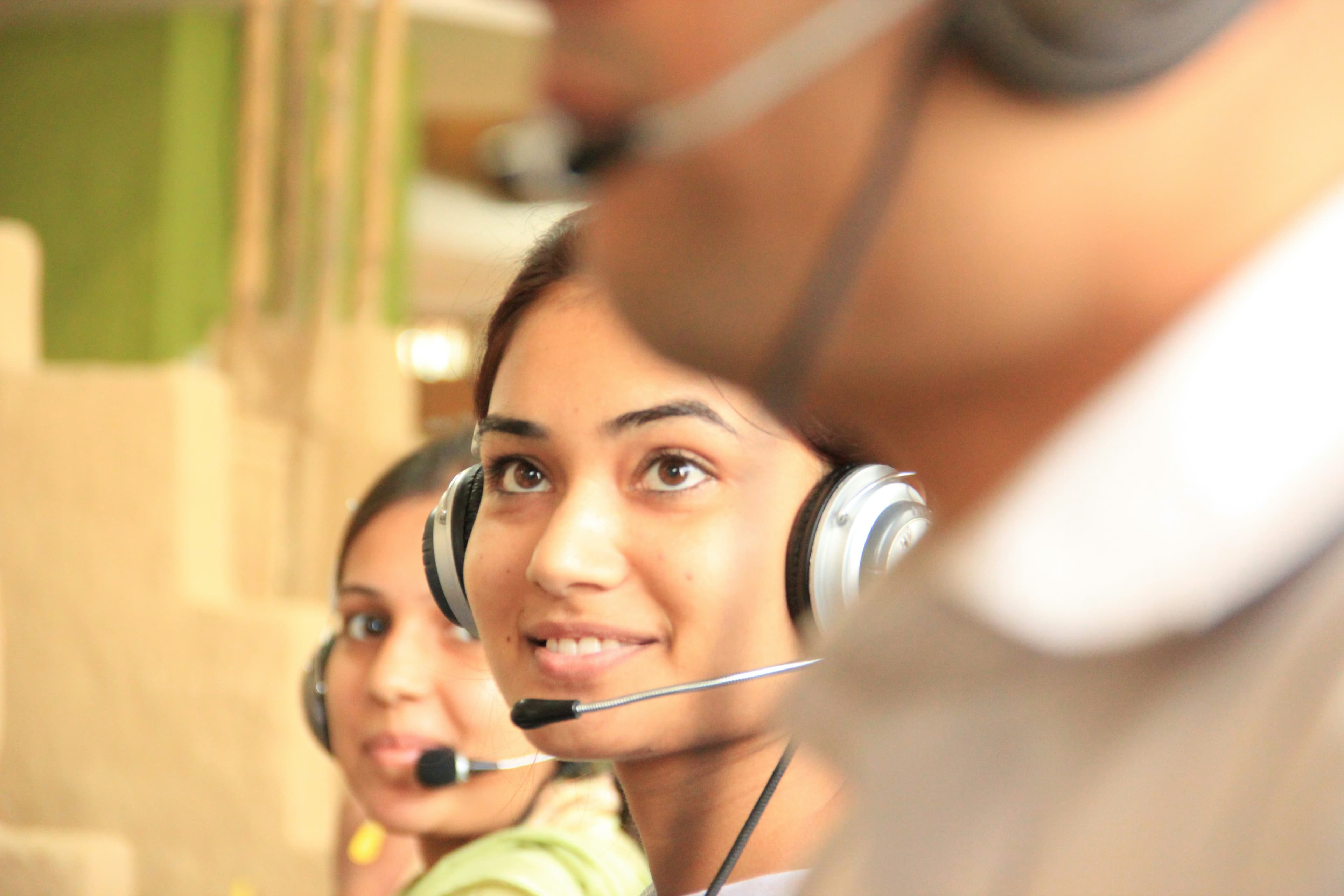 Customer support team members wearing headsets